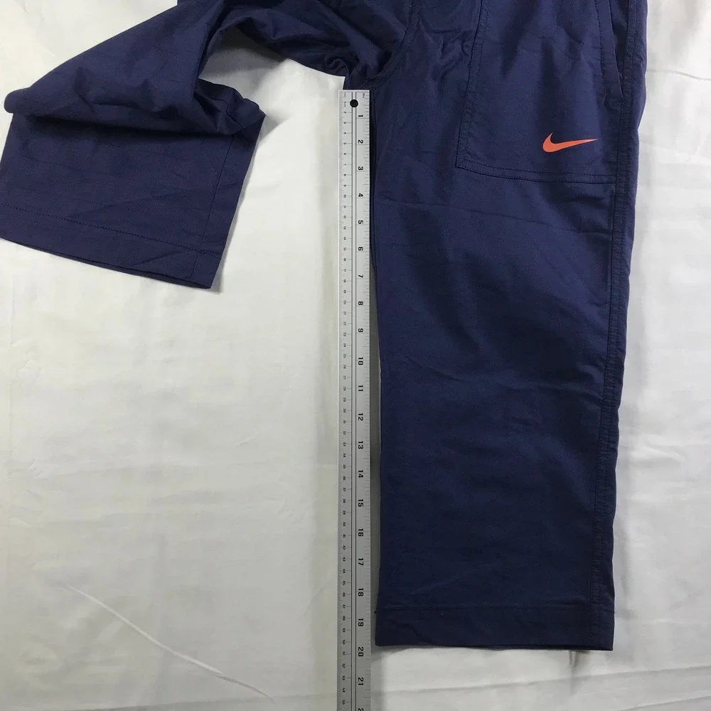 Nike Men's Navy Cargo Pants with Orange Swoosh Accent